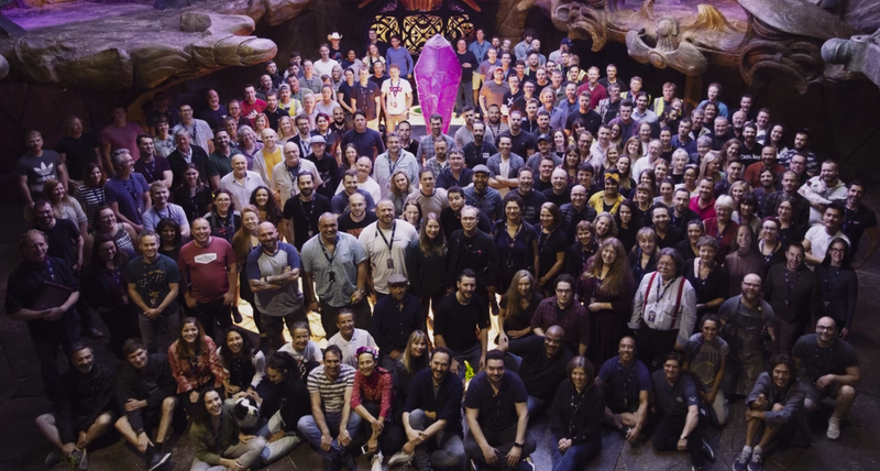The gathered crew of Age of Resistance, around the titular Dark Crystal.